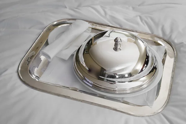 Domed silver lid on plate — Stock Photo, Image