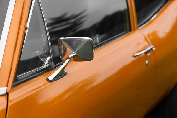 Wing mirror of an orange vintage car — Stock Photo, Image