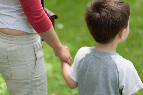 Mother with little boy holding hands — Stock Photo, Image
