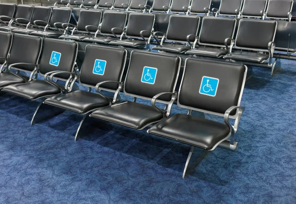 Disabled sign chairs in first row — Stock Photo, Image