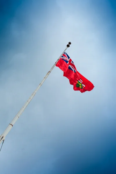 Ontario flag against cloudy sky — Stock Photo, Image