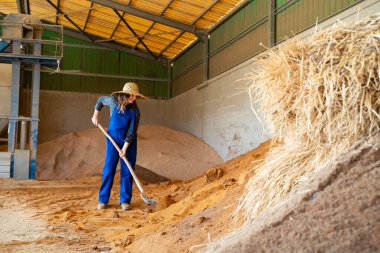 a young woman working alone at farm