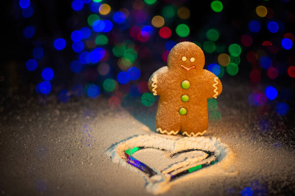 Gingerbread man sprinkled with icing sugar