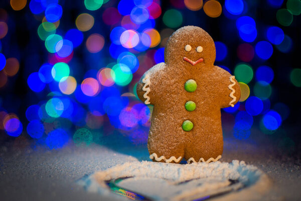 Gingerbread man sprinkled with icing sugar