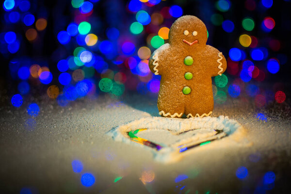 Gingerbread man sprinkled with icing sugar