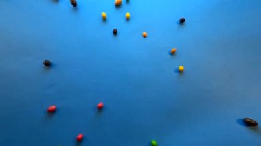 Arkaplan için çok renkli jöleli şekerlerin hareketi