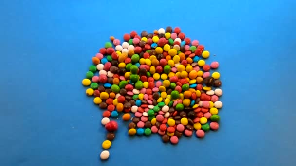 Bewegung Von Süßigkeiten Mit Mehrfarbiger Glasur Für Den Hintergrund — Stockvideo