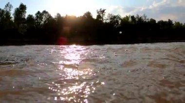 Splashing in the rays of the sun on a mountain river