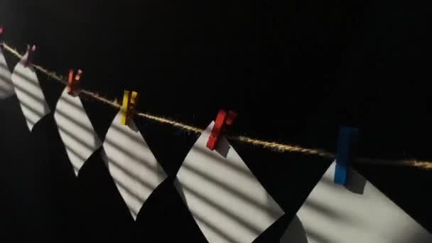 White Pieces Paper Striped Shadows Flutter Clothesline — Stock Video