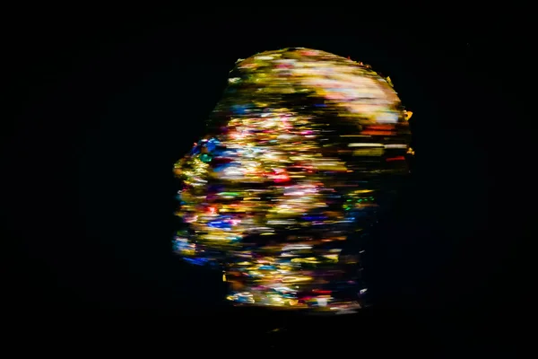 Festive blurred textured head outline on golden background