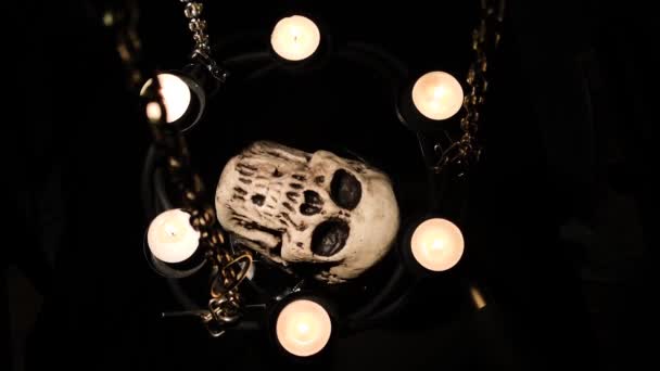 Dummy Human Skull Surrounded Candles Chains — Stock Video