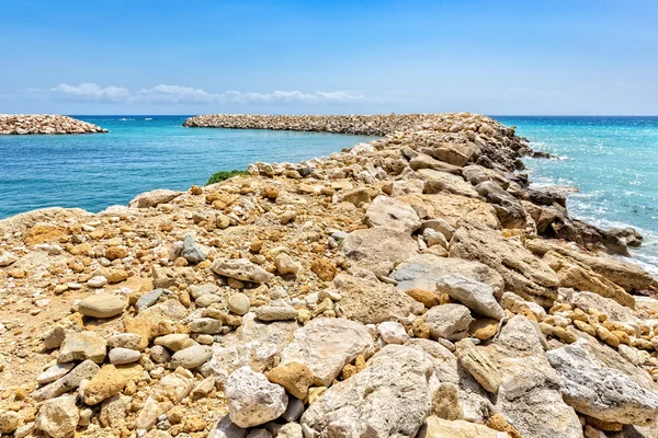 Row of stones as  weir in greek sea