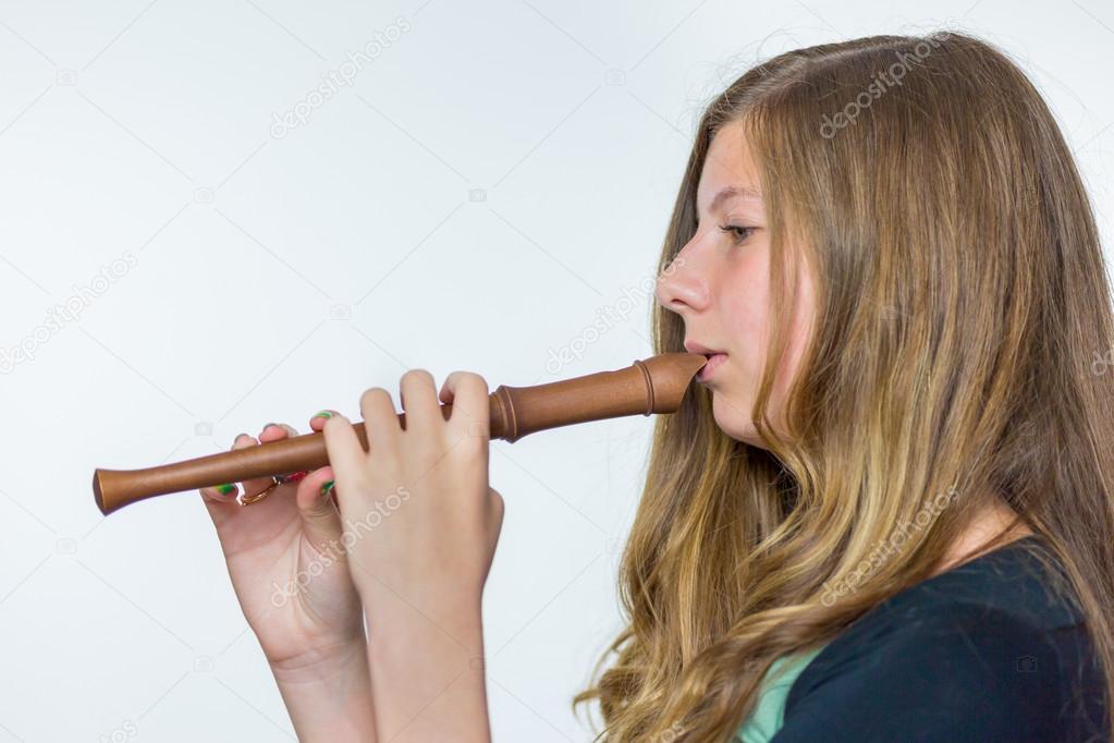Blonde dutch teenage girl playing flute
