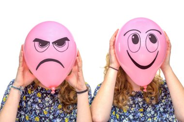 Two girls holding pink balloons with facial expressions clipart