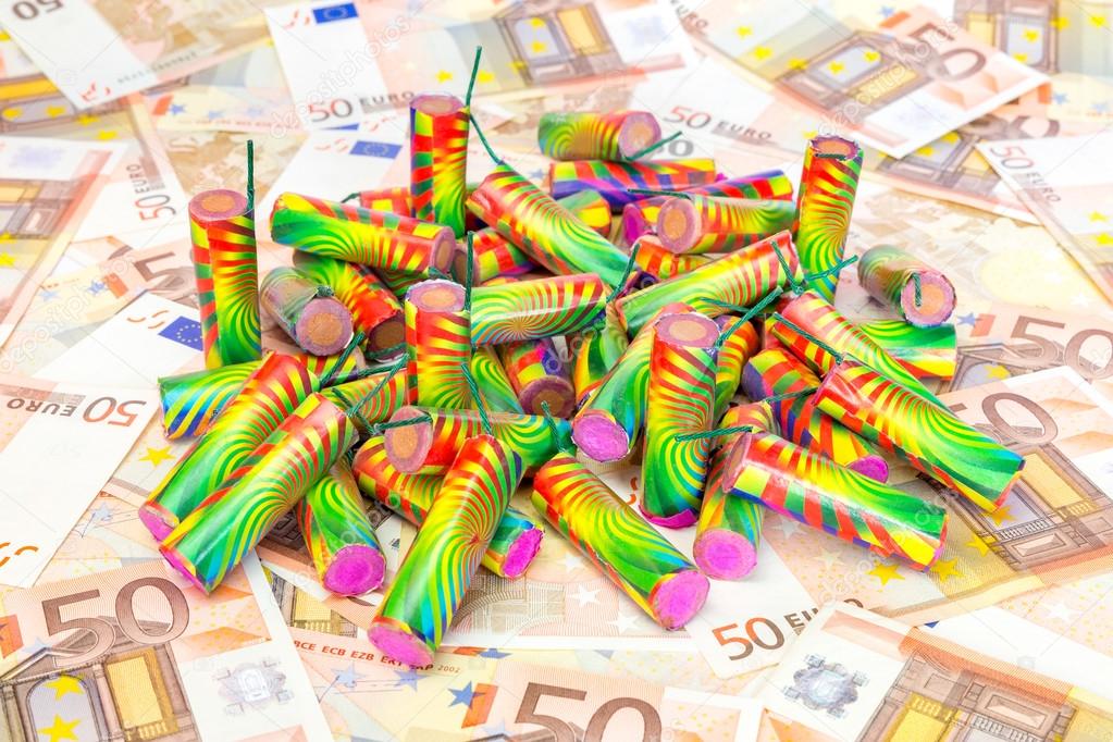 Heap of colorful fire work on spread euro notes