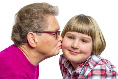 Dutch grandmother kisses grandchild on cheek clipart