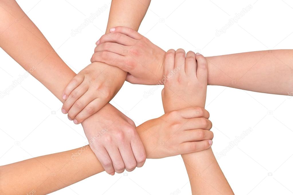 Five arms of children holding together on white background