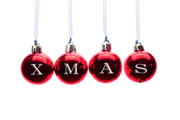 Wort Weihnachten auf roten Weihnachtskugeln auf weißem Hintergrund — Stockfoto