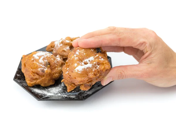 Mano mostrando oliebol holandés o buñuelo —  Fotos de Stock