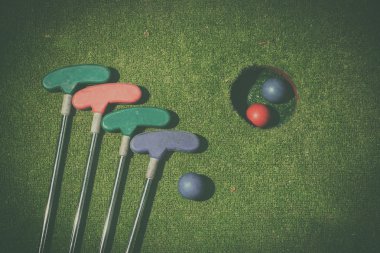 miniature golf hole with bat and ball clipart