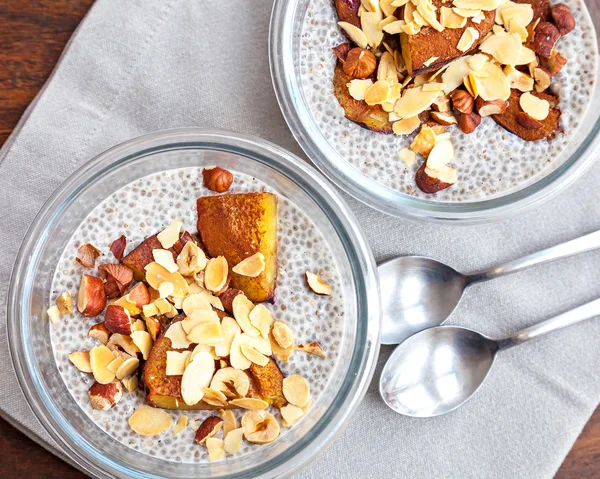 Vanilla chia seed pudding with baked prunes and nuts — Stock Photo, Image