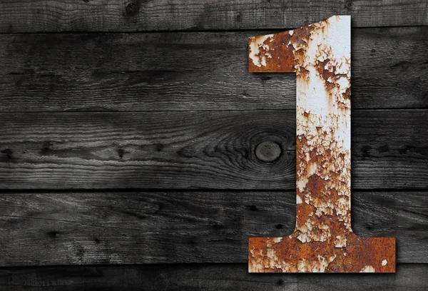 Gamla rostiga metall alfabetet, text 1 på trä bakgrund — Stockfoto