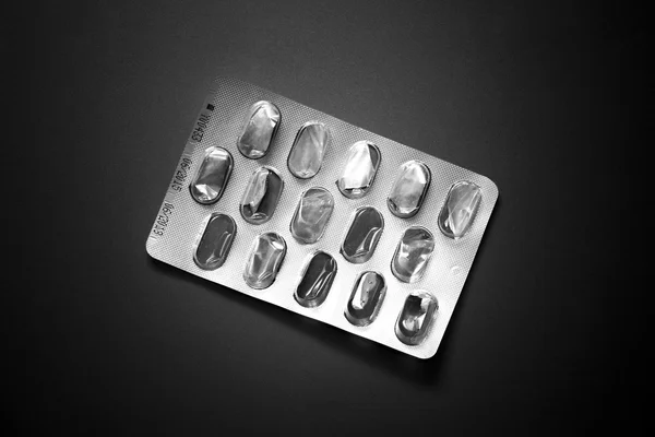 Aluminum of blister pack on a grey background — Stock Photo, Image