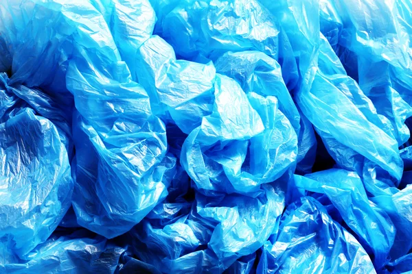 Beaucoup de sacs en plastique bleu froissé — Photo