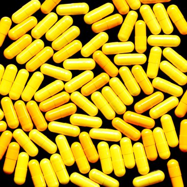 siyah zemin üzerine sarı haplar