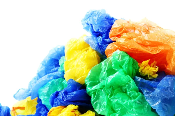 Красочные пластиковые пакеты для мусора на белом фоне — стоковое фото