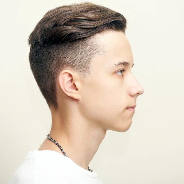 Young man profile face over gray background — Stock Photo, Image