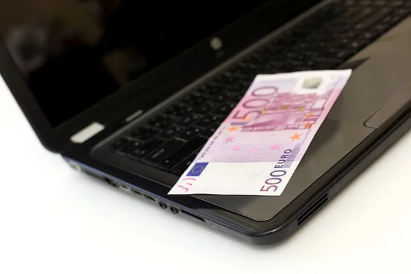 Five hundred euros on laptop keyboard