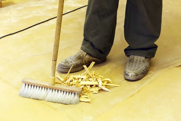 Feet of man in workshop — Stock Photo, Image