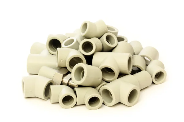 A lot of combined fittings for plastic pipes — Stock Photo, Image