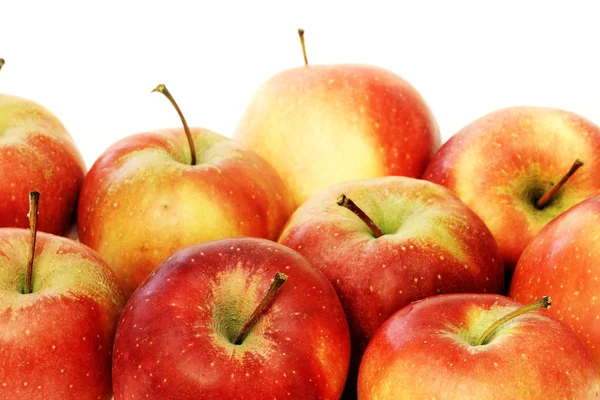 A lot of red apples close up on white background — Stock Photo, Image