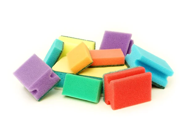 A lot of colourful sponges on a white background — Stock Photo, Image