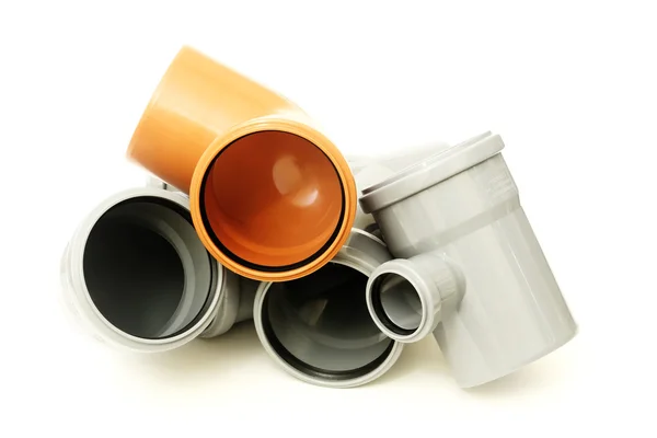 Nuevos tubos de drenaje grises y marrones, aislados en blanco —  Fotos de Stock