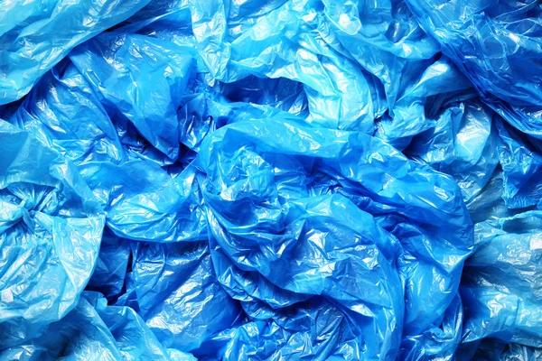 Spoustu pomačkané modré plastové sáčky — Stock fotografie