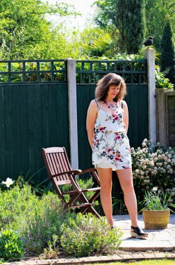 Appreciating a beautiful woman enjoying the green radiance of spring and summer.