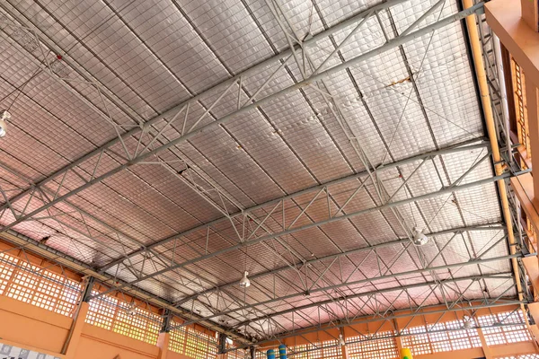 Steel roof structure. Moonlight bulb. Steel structure with roof tiles. Architectural structure of roof. Large roof layout used for industrial plants.