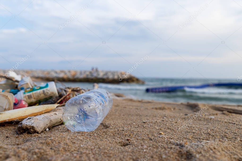 Garbage on the beach. Dirty sea sandy. Trash on beach. plastic bottle. Love the world. Pollution of beaches and sea