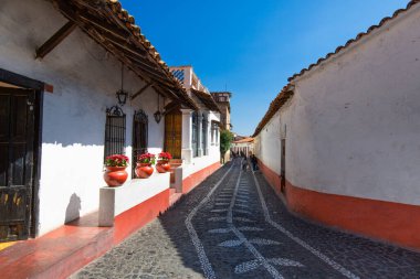 Mexico, Scenic Taxco cobblestone streets in historic city center near Santa Prisca church clipart