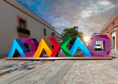 Oaxaca, Mexico, Scenic old city streets and colorful colonial buildings in historic city center clipart