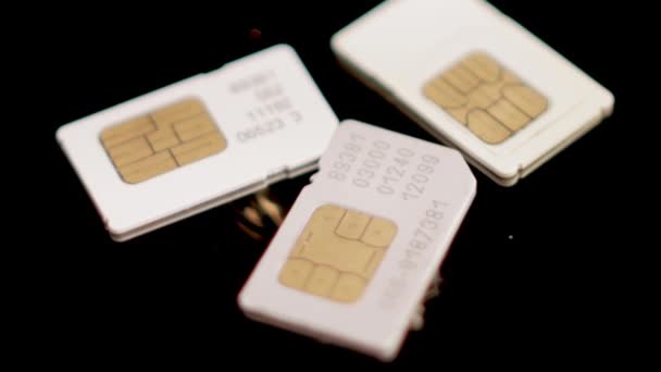 Old SIM Cards. Close Up. Mobile Phones Chip. Black Background, Full Frame — Stock Video