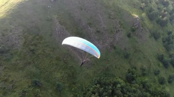 High Angle Aerial View of Parachute Flying Above Green Mountain Hills on Summer — Stock Video