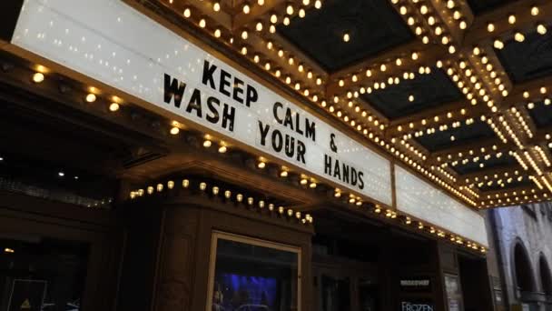 Coronavirus Pandemic, Keep Calm and Wash Your Hands Sign at Theatre Entrance USA — Stock Video