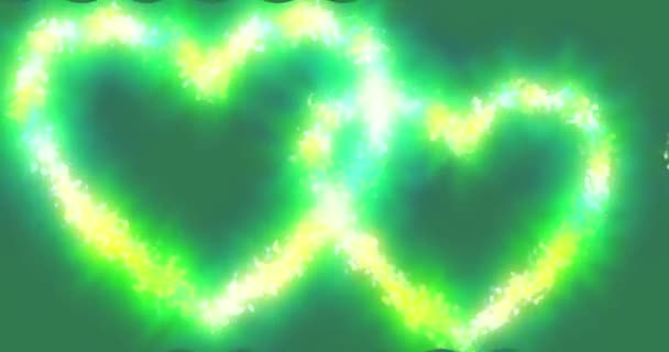 Zwei Leuchtende Herzen Auf Grünem Hintergrund Die Kontur Verändert Sich — Stockvideo