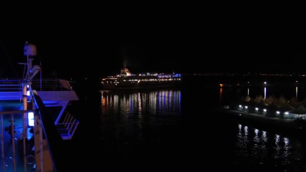 Civitavecchia, Italy, november 2015.Lighted large ship at night near the harbor.Civitavecchia is the main starting point for sea connection from central Italy to Sardinia, Sicily, Malta and Tunis . — стоковое видео