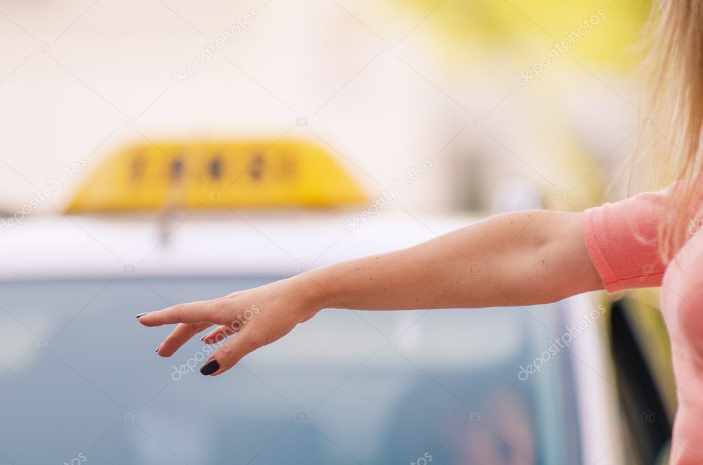 Woman calling a taxi