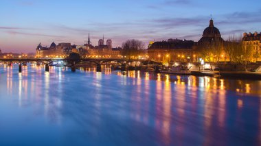 Seine river and Old Town of Paris clipart